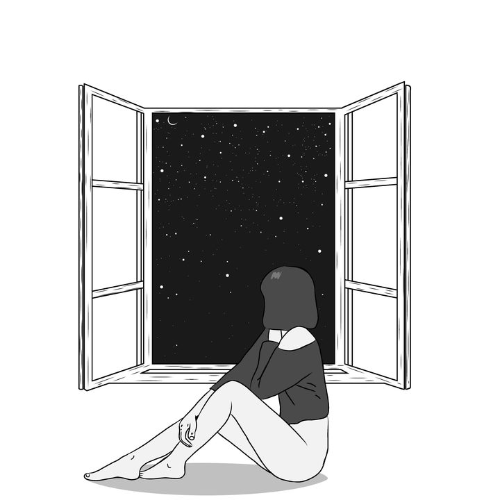 A child at a rain-streaked window